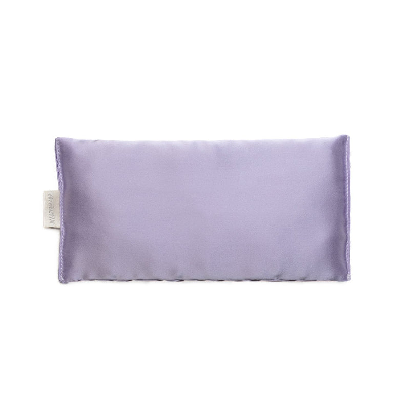 A elizabeth W lavender-filled silk eye mask with a smooth texture and a visible tag on the side, displayed on a white background.