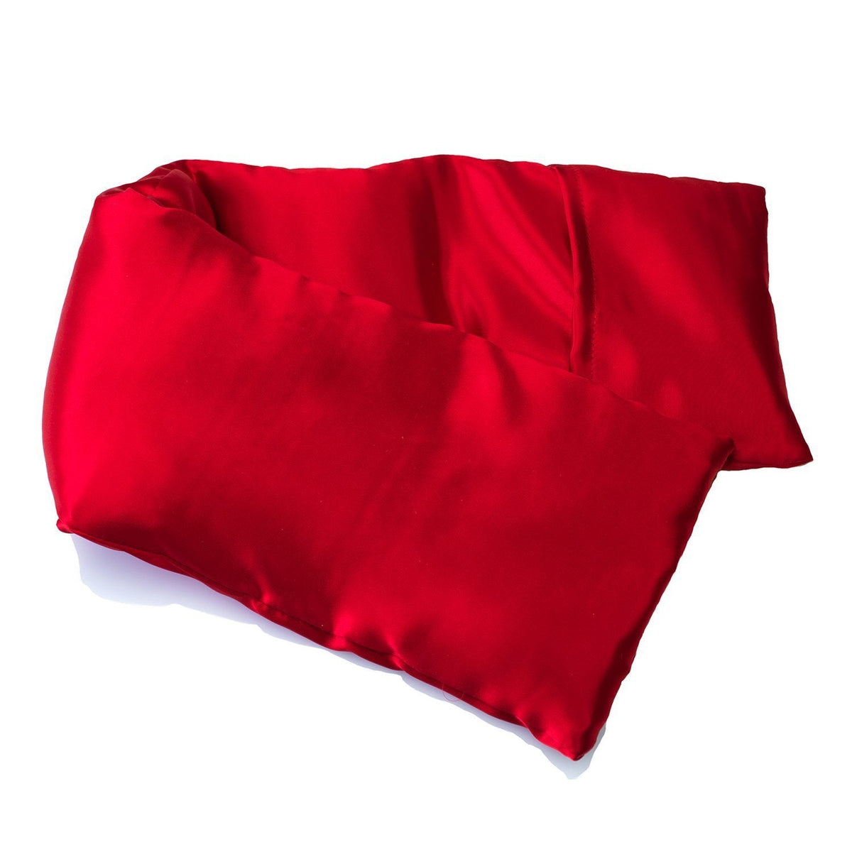 A vibrant red satin pillowcase with smooth texture, slightly wrinkled, featuring an elizabeth W Silk Hot/Cold Flaxseed Pack - Red, isolated on a white background.