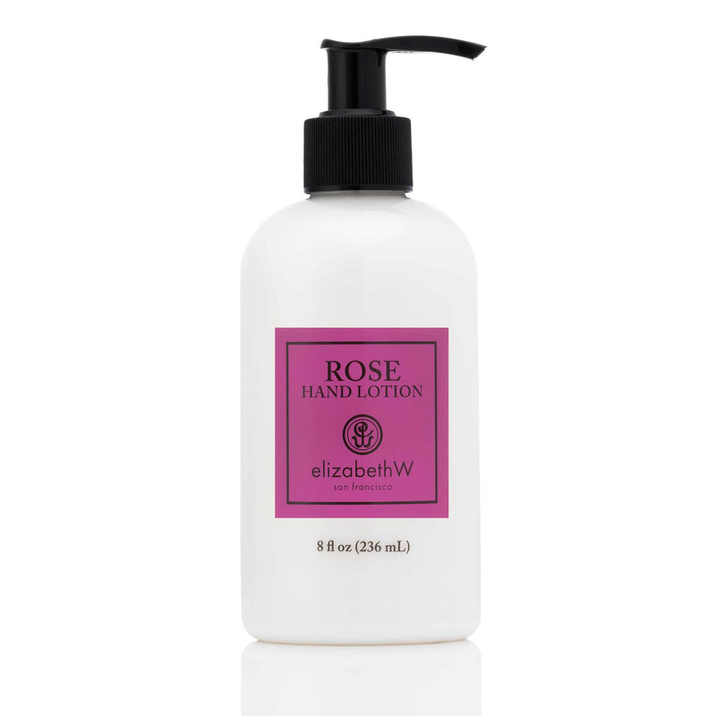 White bottle of elizabeth W Signature Rose hand lotion with a black pump and pink label, featuring lasting hydration, isolated on a white background.