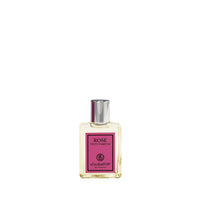 A clear glass bottle of elizabeth W Signature Rose Eau de Parfum Petite on a white background. The bottle has a simple rectangular shape with a silver cap, and a purple label with white text.