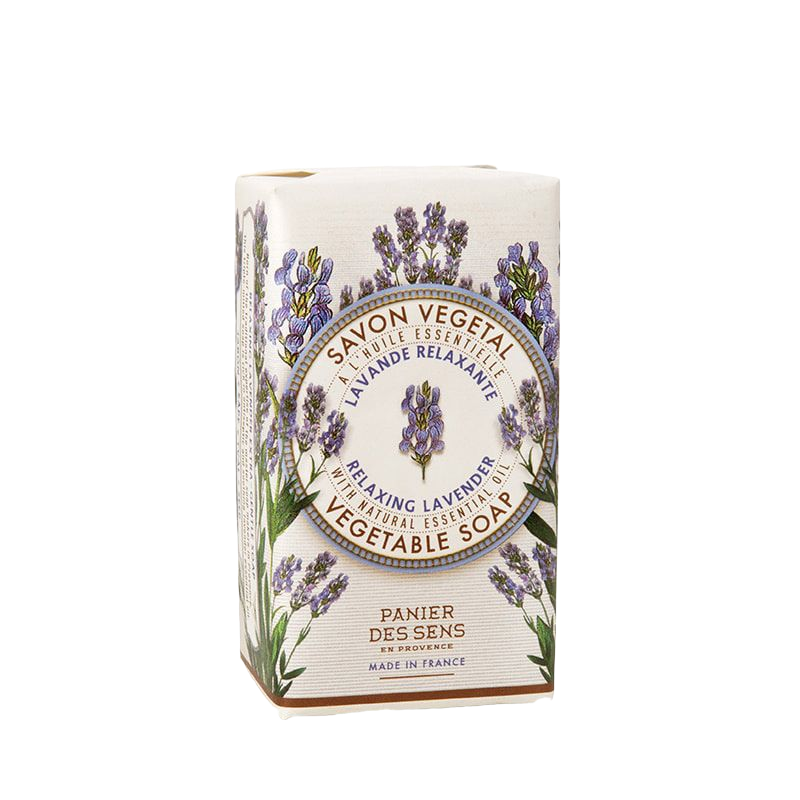A bar of Panier Des Sens Lavender Soap Bar in a box adorned with lavender illustrations and French text, indicating its relaxing lavender essential oil scent and French origin.