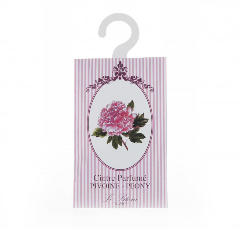 A hanging sachet with a pink and white striped background featuring an oval frame with an illustration of a Le Blanc Peony Scented Hanger Sachet. Text "cintre parfumé pivoine peony" Made in France.