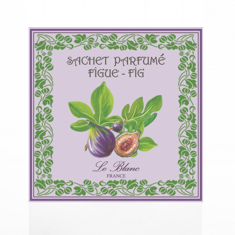 Label design for a Le Blanc Fig Scented Sachet featuring illustrations of whole and cut figs surrounded by green leaves, encased in a decorative green and purple border with French text.