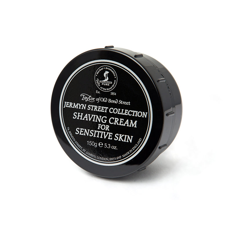 A black container of Taylor of Old Bond Street Jermyn Street Collection Sensitive Skin Shaving Cream 150g, showing the brand details and weight on the lid.