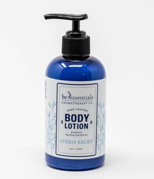 A blue bottle of BC Essentials Stress Relief Body Lotion - 8oz with a pump dispenser on a white background, labeled for stress relief.