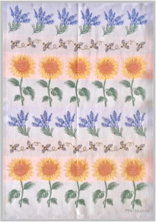 A symmetrical pattern of embroidered flowers on 100% cotton fabric, featuring rows of purple lavender and yellow sunflowers, each set interspersed with a delicate vine design. European Tea Towel - Swedish Lavender, Bees & Sunflowers by Mierco.