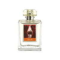A square glass perfume bottle with a clear, textured design and a gold-tone cap. The label features an abstract art portrait in red and orange tones with the text "Carthusia Terra Mia Eau de Parfum" by Carthusia I Profumi de Capri.