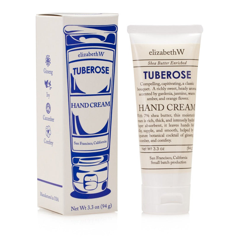 Two elizabeth W Small Batch Apothecary Tuberose Hand Cream products, one in a white tube and the other in a sleek box with blue and white vintage-style detailing, both labeled clearly with product information.