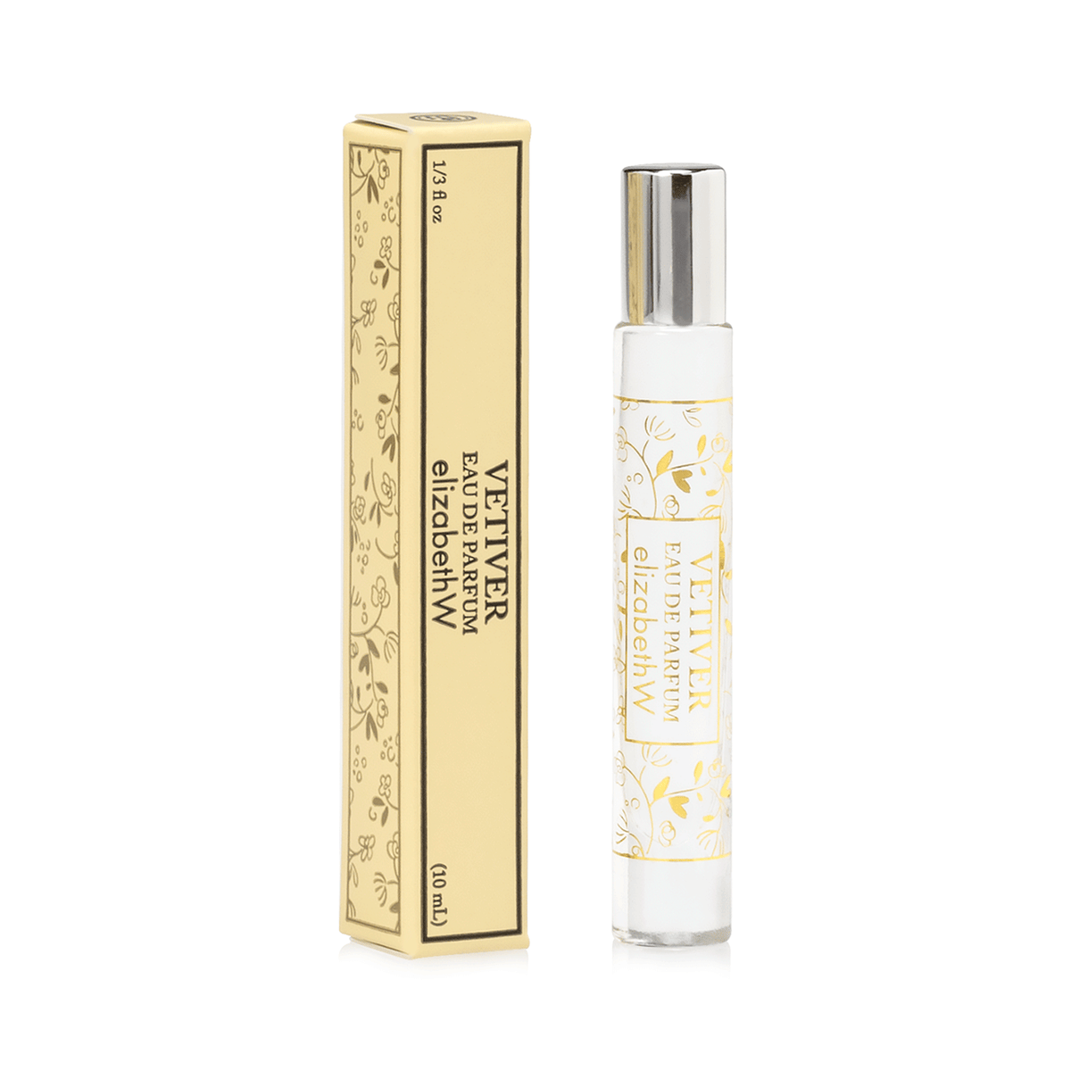 A vetiver perfume in a transparent spray bottle next to its yellow and gold decorative box adorned with floral patterns, displayed on a white background. This Elizabeth W Signature Vetiver Rollerball features.