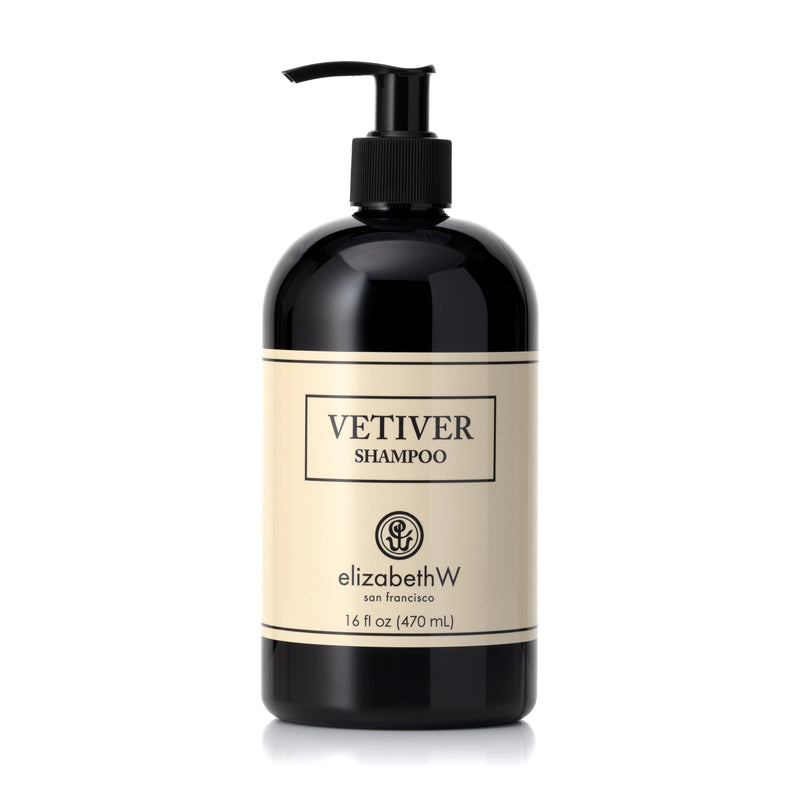 A bottle of Elizabeth W Signature Vetiver Shampoo for all hair types with a pump dispenser, labeled clearly in elegant script on a cream-colored label, against a white background.