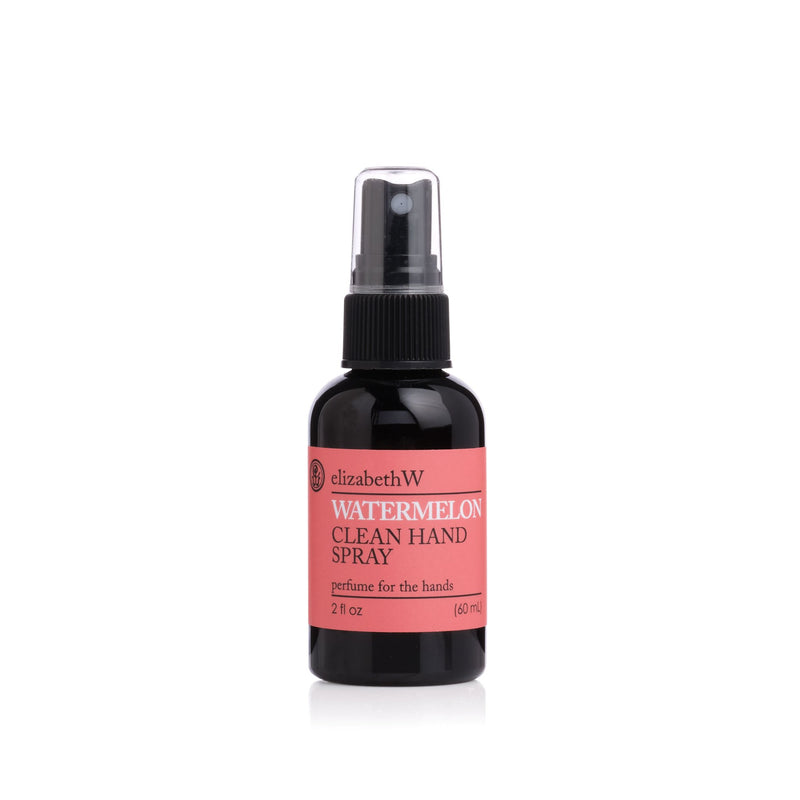 A bottle of elizabeth W Botanical Beauty Watermelon Clean Hand Spray with essential oils, featuring a spray nozzle, labeled "perfume for the hands," against a white background.