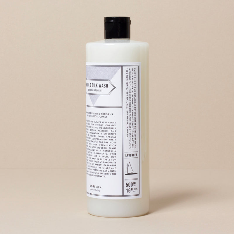 A 500 ml bottle of Norfolk Natural Living Lavender Wool & Silk Wash detergent labeled with text and details sits against a neutral background. The product, featuring a botanical formulation, is scented with lavender, as indicated on.