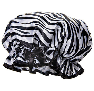 A Shower Caps Fancy Shower Cap - Zebra Print with a black bow on the front, displayed against a white background.